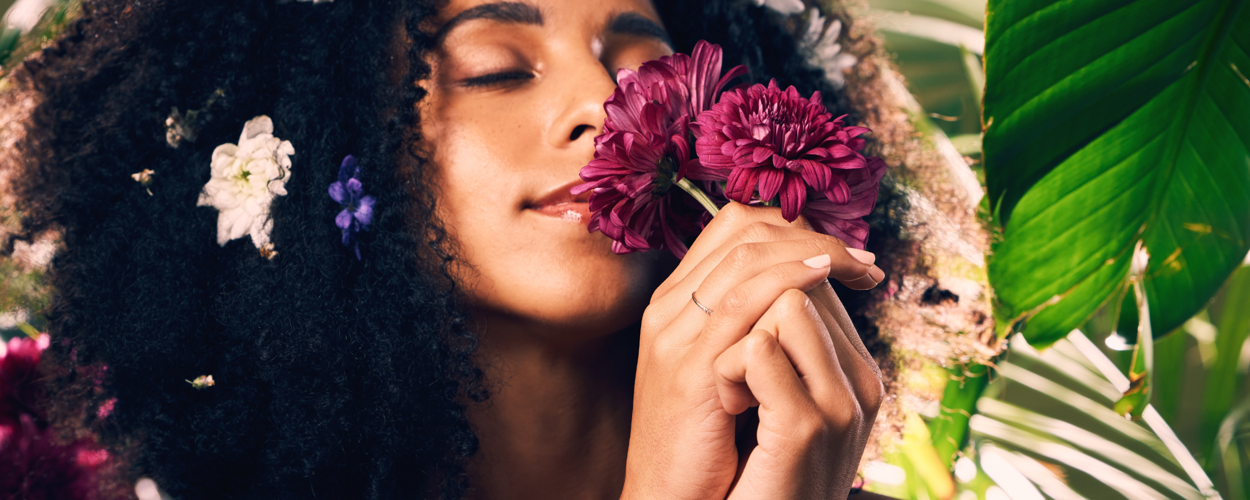 woman in nature with flower clean skincare