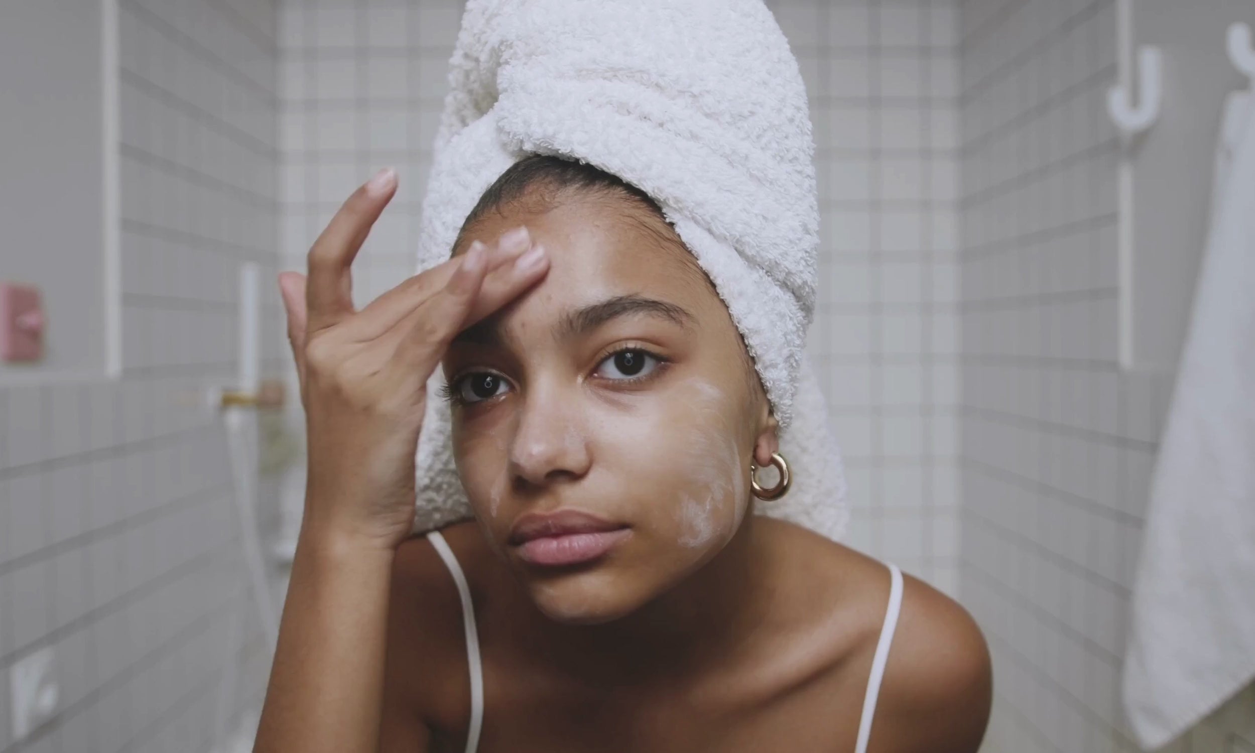 Load video: woman cleaning face clean beauty skincare